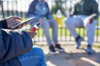 Vape Teens vaping in a park