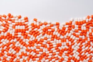 Abundance of Orange Colored Capsule Pills - BMJ Group