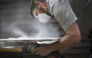 Man working with artificial stone