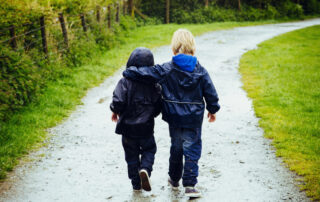 Two little brothers walking together