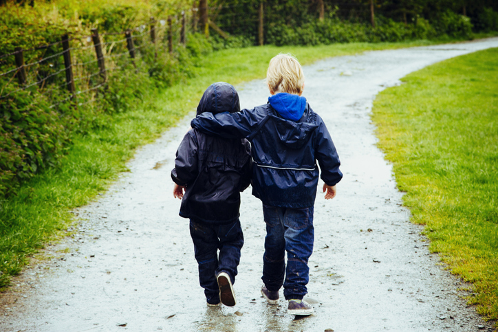 Two little brothers walking together