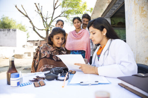 Indian doctor with patients