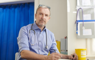 Male doctor in treatment room