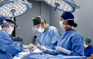 Female surgeon operating patient at emergency room