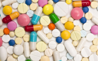 Various pills of different shapes and colours