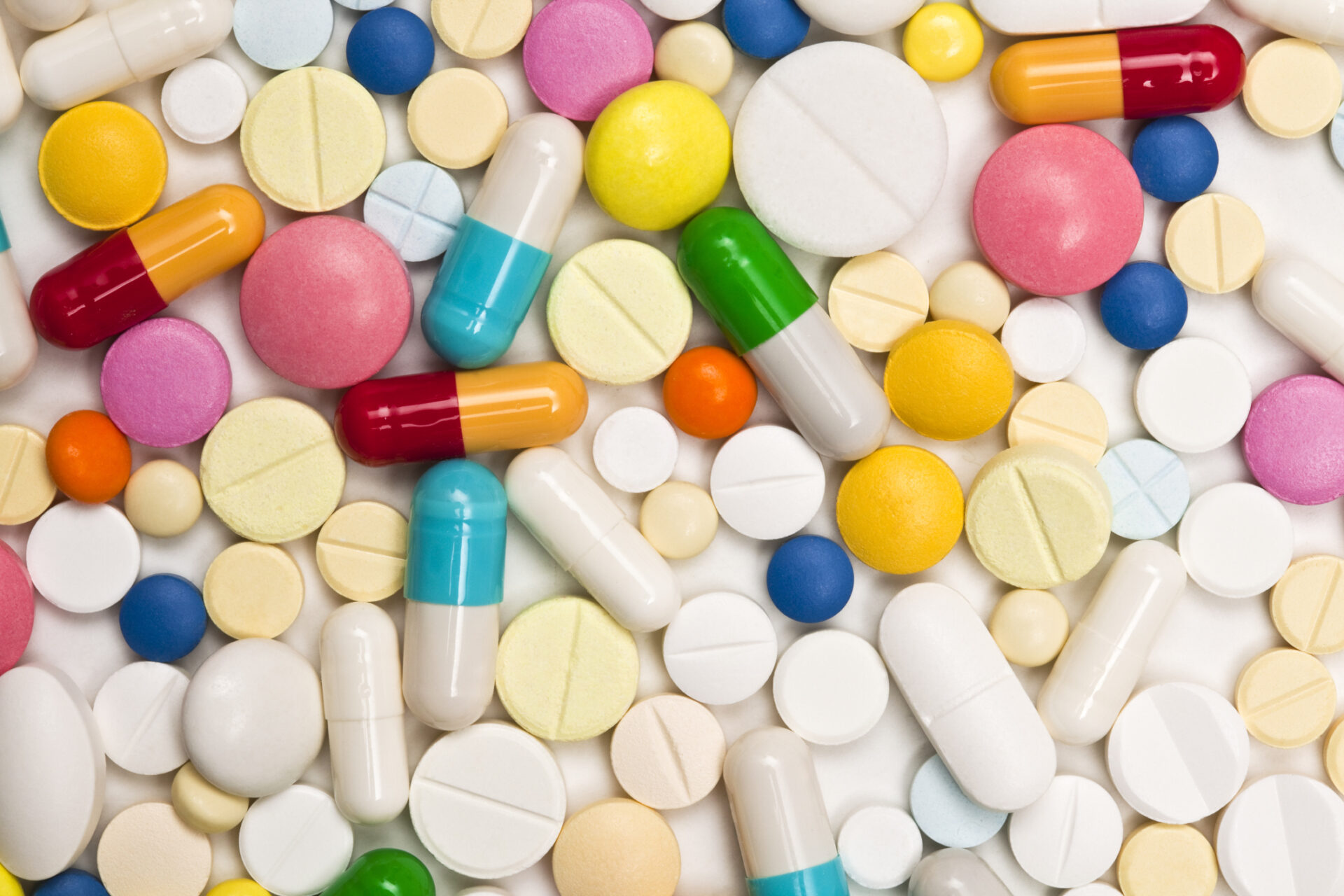 Various pills of different shapes and colours