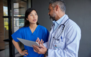 A doctor and nurse having a discussion