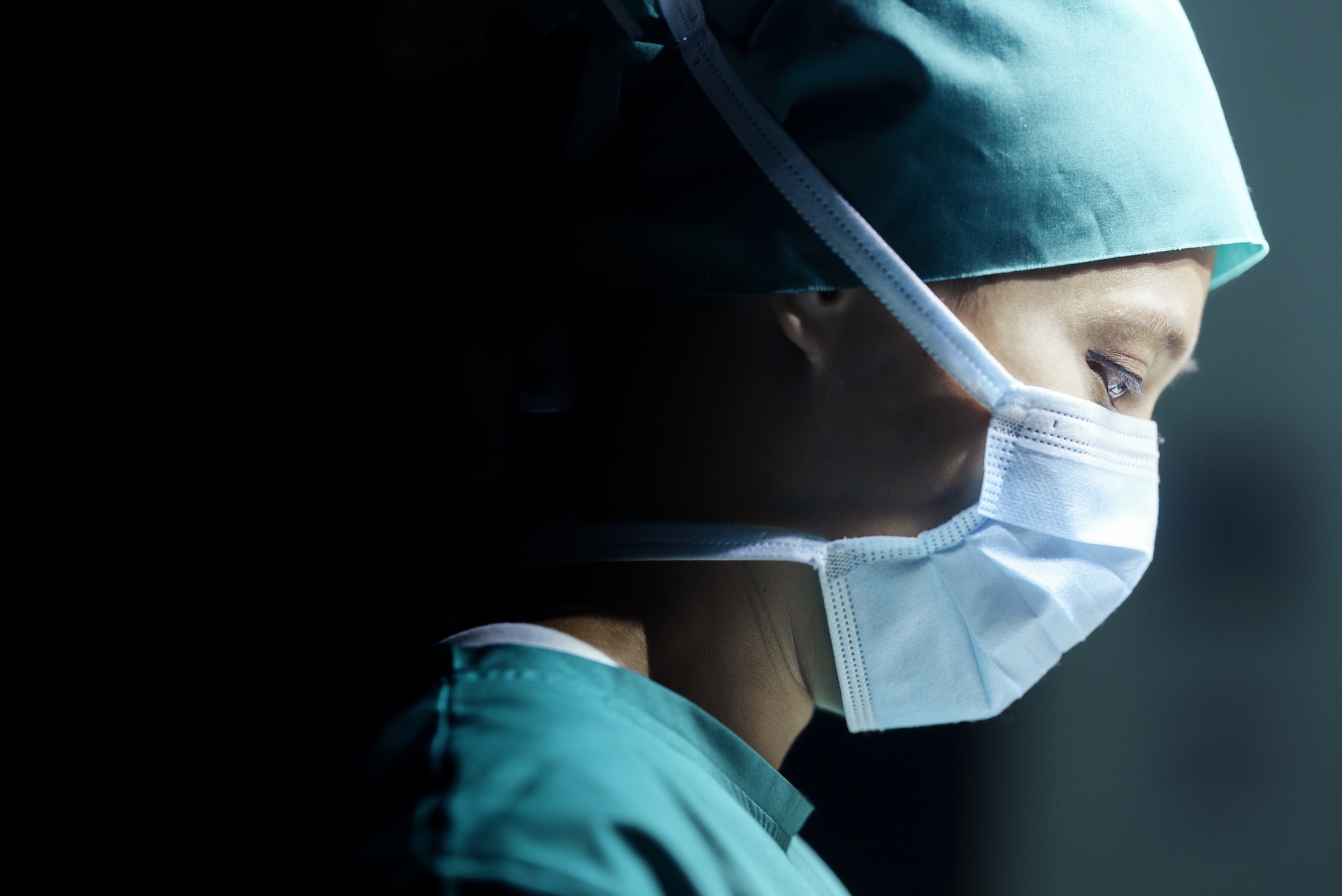 facial expression Close-up of a young adult female surgeon operating and wearing a surgical mask and copy space - BMJ Group