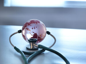 global Healthcare a glass globe and a stethoscope