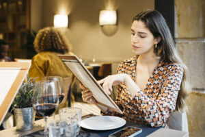 Women reading a menu in a restaurant