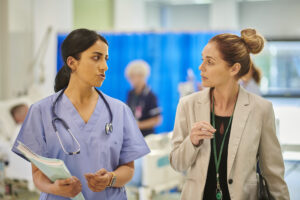 hospital consultant chatting to administrator