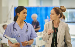 hospital consultant chatting to administrator