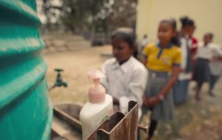 Children lining up to wash hands