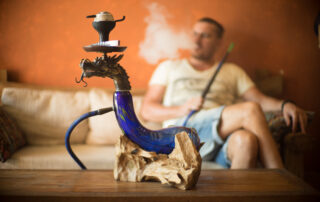 man smoking shisha