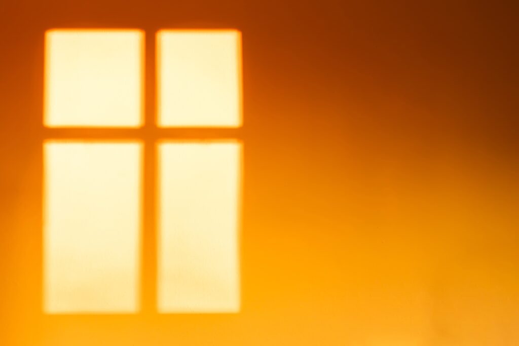 Shade of a window on a wall with sunset light - BMJ Group
