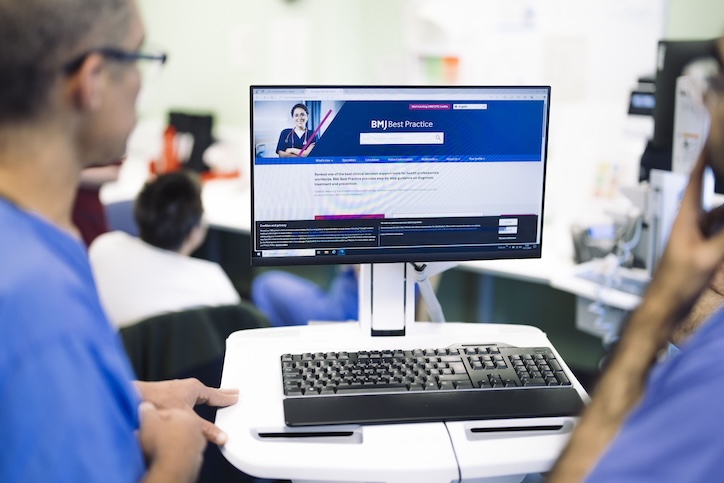 image of people looking at bmj healthcare on a screen